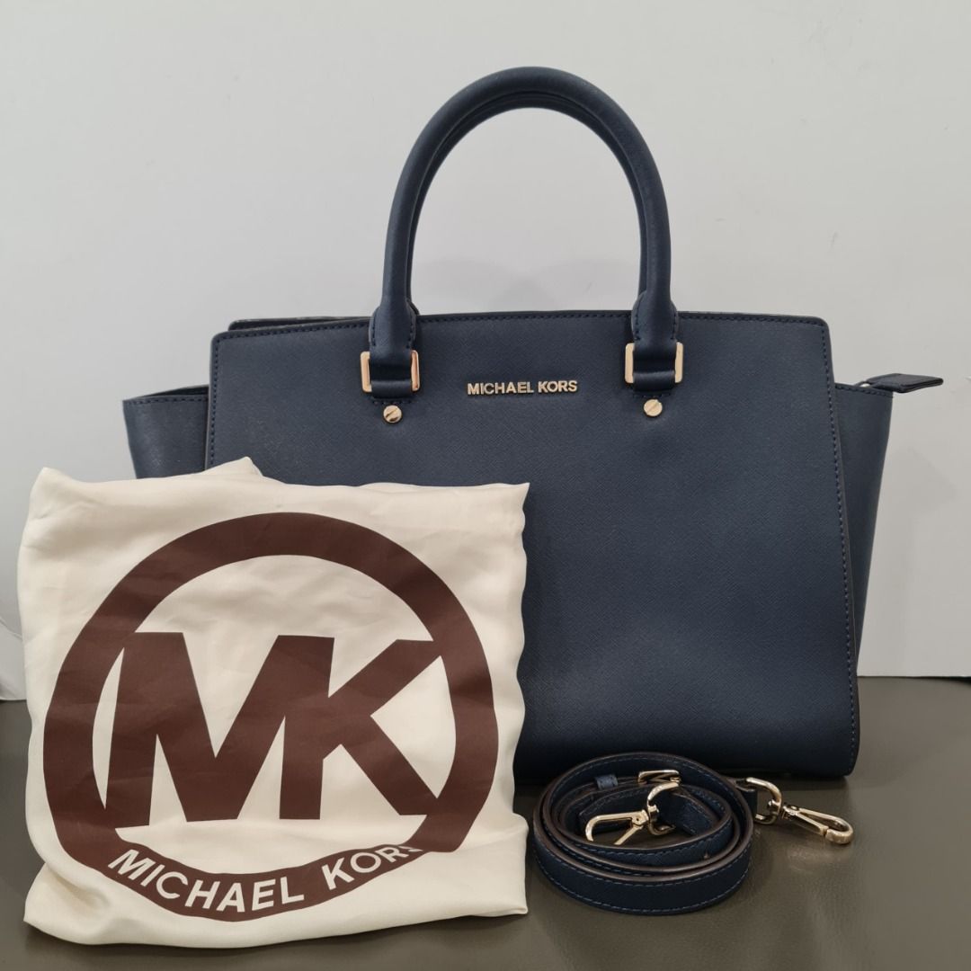 MICHAEL KORS SELMA NAVY SAFFIANO LEATHER SATCHEL BAG GHW (Category: Bags & Wallets) located in Kuala Lumpur. Submitted by larueonlinestore (Listing ID 1380116822, Image 1). Description: LAR-3999-MK (Pre-owned) Brand - MICHAEL KORS Model - SELMA Size - 33CM Color - NAVY Material - SAFFIANO LEATHER & GHW Accessories - DUST COVER, STRAP Condition - USED Visit our store to view the actual product P-1-17 Plaza Damas, Jalan Sri Hartamas 1, 50480 Kuala 