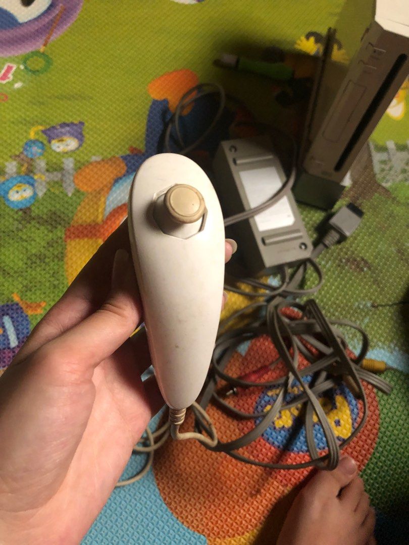nintendo wii remote controller (Category: Nintendo) located in Manila. Submitted by esmiexhu (Listing ID 1374604004, Image 3). Description: perfectly working. Free Nunchuck and 3 wii mote protection/ cover.