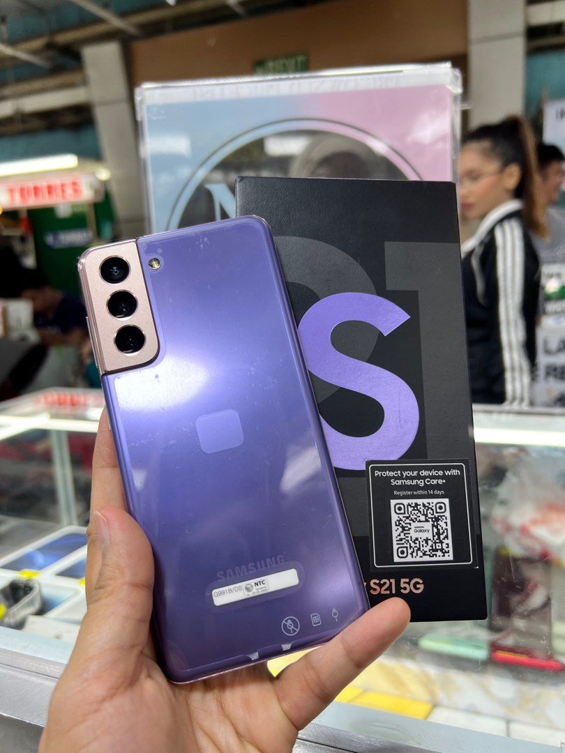 Preloved Samsung S21 5G (Category: Samsung) located in Pasig City. Submitted by abrodin19823279 (Listing ID 1380163454, Image 1). Description: NTC approved 256GB/ 8GB Ram ✅ No scratches ✅ No Dent 💯% smoothness ✅ No Amoled Burn ✅ No LCD issue ✅ No history of repair Openline dual Sim Comes With same serial Box faster Charging Adapter and Cable. More Freebies screen Protector and Clear Case.😊 .