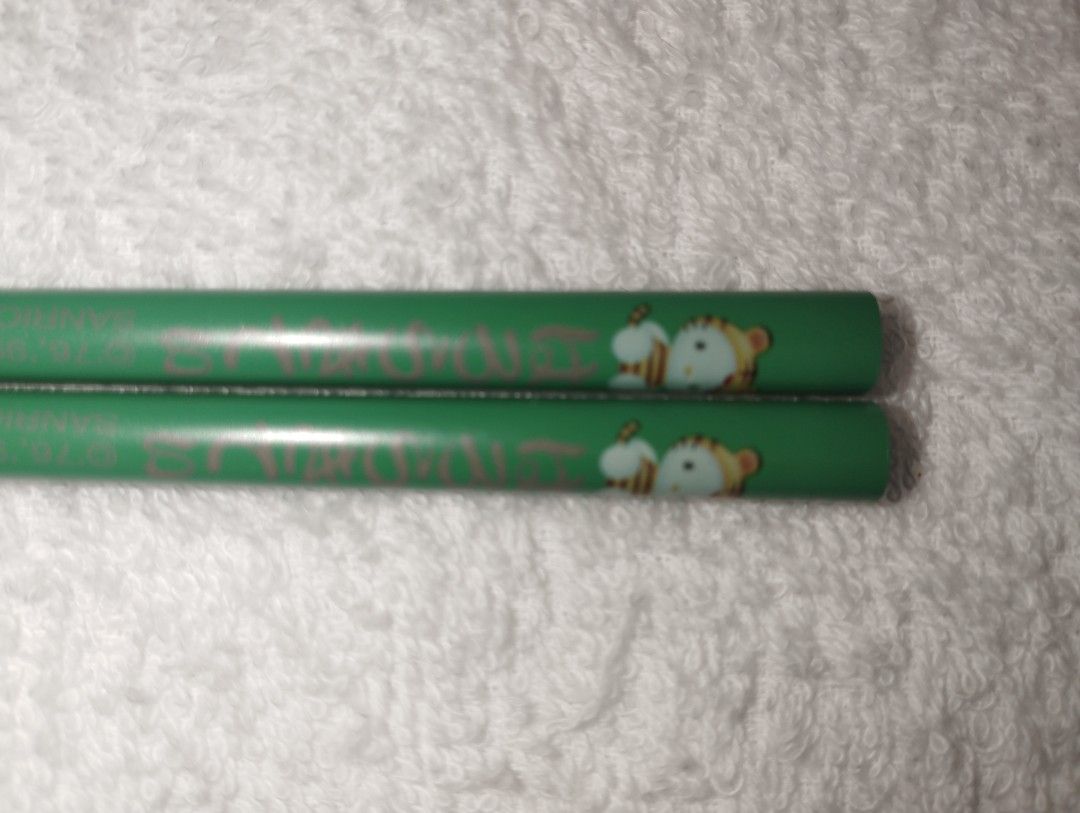 Sanrio Hello Kitty Collectible Chopsticks (Category: Dinnerware & Cutlery) located in Muntinlupa City. Submitted by fnovelties (Listing ID 1380226455, Image 3). Description: Sanrio brand Hello Kitty Chopsticks 2 pairs green (identical) 1 pair yellow 1 pair purple 18 cm rfs: decluttering.