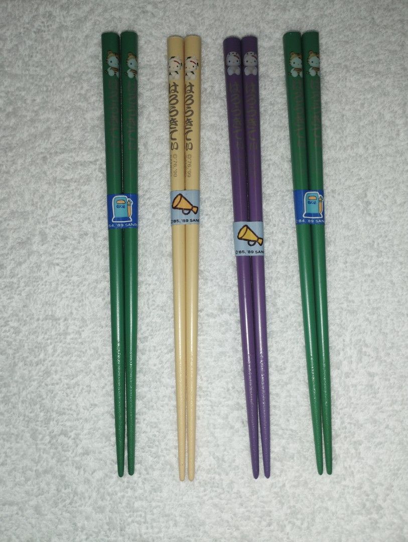 Sanrio Hello Kitty Collectible Chopsticks (Category: Dinnerware & Cutlery) located in Muntinlupa City. Submitted by fnovelties (Listing ID 1380226455, Image 1). Description: Sanrio brand Hello Kitty Chopsticks 2 pairs green (identical) 1 pair yellow 1 pair purple 18 cm rfs: decluttering.