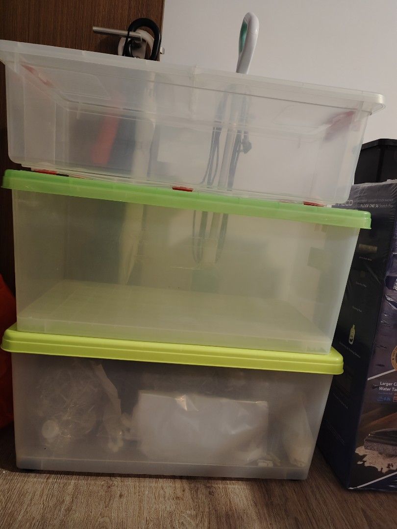 Storage Boxes ( 1 for $10, 3 for $25) (Category: Storage Boxes & Baskets) located in Singapore. Submitted by bluerollingcar (Listing ID 1380187514, Image 1). Description: - 3 stackable storage boxes $10 each, buy 3 for $25 - dimensions L72cm x W39cm x H21 31/34cm - Clear plastic with green and yellow lids - Perfect for organizing your belongings - Suitable for clothes, toys, and other household items - Boxes show signs of use but are still functi