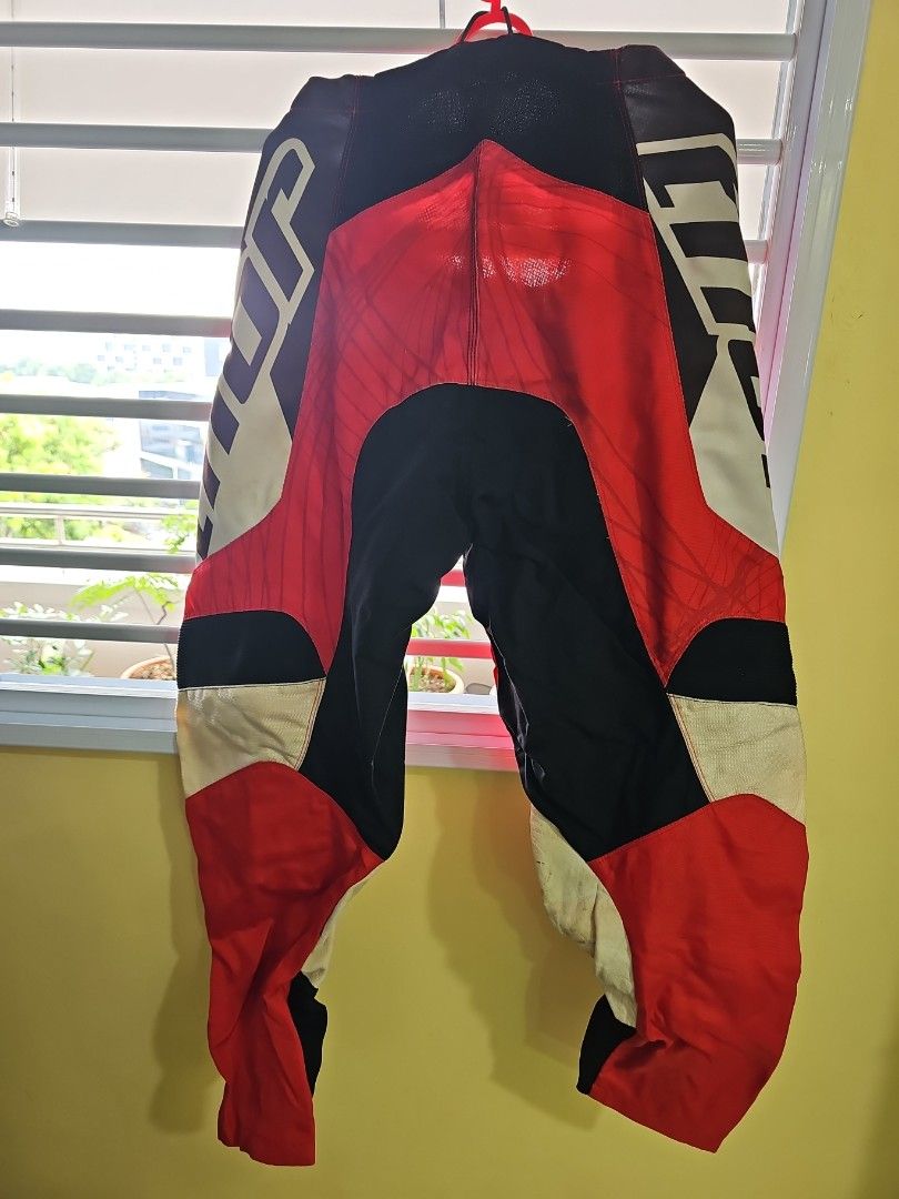 Thor Motorcycle Pants - Red, Black, White - Size 34 (Category: Motorcycle Apparel) located in Singapore. Submitted by cucunenek13 (Listing ID 1380133554, Image 3). Description: - Thor motorcycle pants - Size 34 - Good condition - Eye-catching red, black, and white design - Well-maintained - Ideal for motorcycle riders.