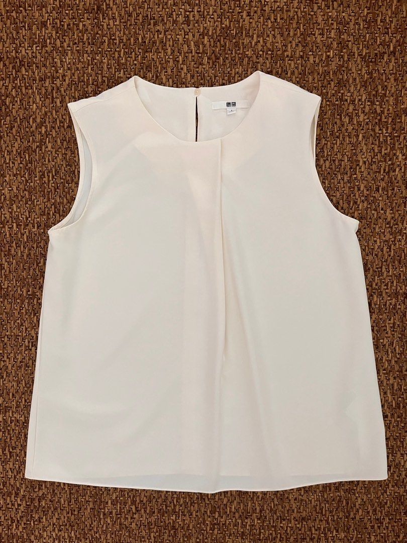 Uniqlo Tops (Category: Sleeveless) located in Paranaque City. Submitted by threadup (Listing ID 1380109777, Image 2). Description: Selling as a bundle. Size Small. Good condition..