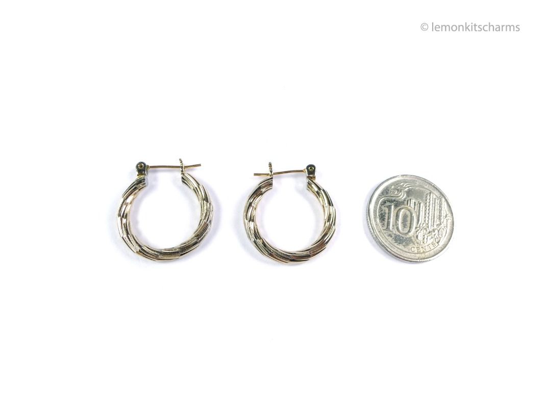 Vintage 1990s Pale Goldtone Hoop Pierced Earrings, er2699-ci (Category: Earrings) located in Singapore. Submitted by lemonkitscharms (Listing ID 1380264354, Image 2). Description: Vintage 1990s Pale Goldtone Striped Hoop Earrings, for pierced ears. Very slight verdigris on the inner grooves of the catch, not obvious with the naked eye, I only see it with a magnifying loupe. Good wearable condition. This is a very pale goldtone colour, small hoops
