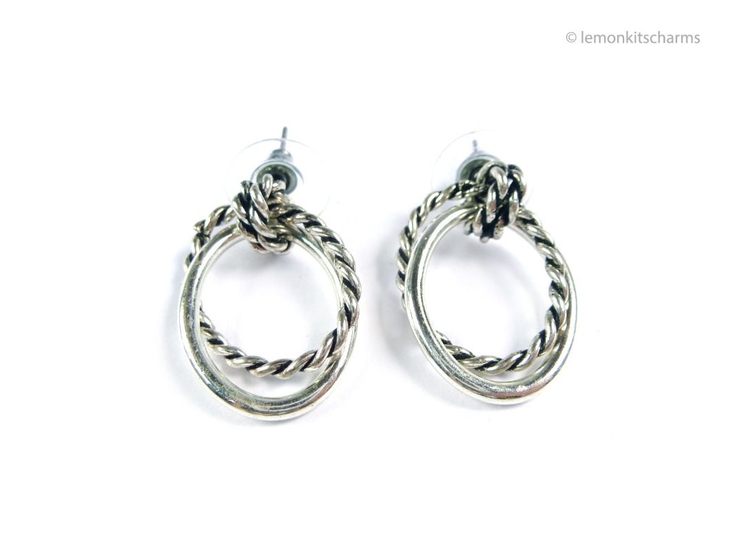 Vintage 1990s Silvertone Roped Doorknocker Pierced Earrings, er2691-ci (Category: Earrings) located in Singapore. Submitted by lemonkitscharms (Listing ID 1380134505, Image 1). Description: Vintage 1990s - Y2K Silvertone Roped Doorknocker Styled Earrings, for pierced ears. Clutches are new. Very good condition. Double interlooping oval rings with roped design. Price excludes postage. Check my profile for postage rates. Size: 26 x 17mm - Sorry NO 