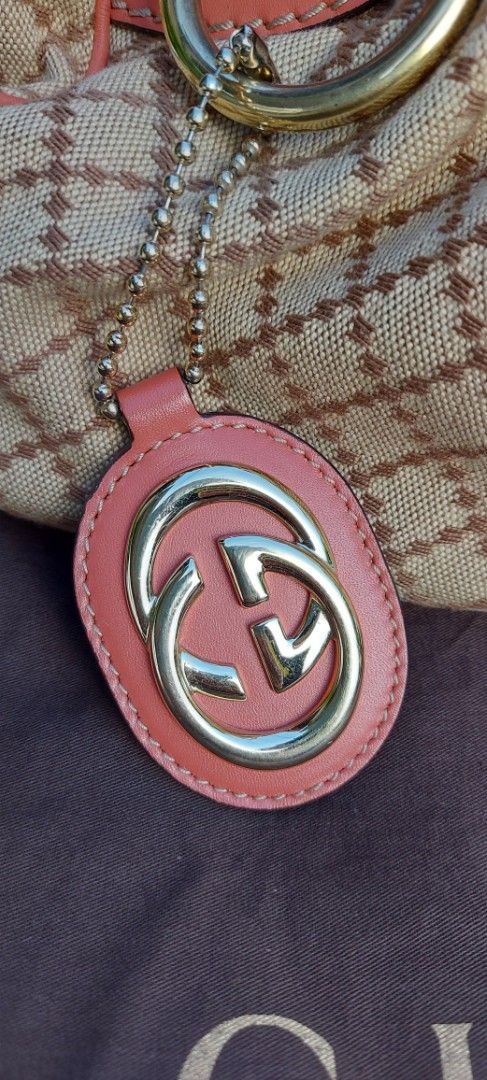 GUCCI SUKEY CANVAS HANDBAG (Category: Luxury Bags & Wallets) located in Davao. Submitted by fucollections (Listing ID 1380375064, Image 2). Description: Preowned. Lining material canvas Hardware - gold plated With sign of used inside like pen mark, stain but body outside is good. Can send more pictures for sure buyer..