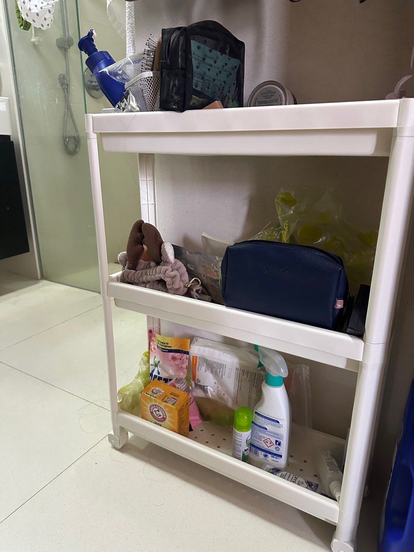 IKEA White plastic Shelf/Toilet storage (Category: Shelves, Cabinets & Racks) located in Singapore. Submitted by xfifionaa (Listing ID 1380315842, Image 3). Description: IKEA VESKEN shelf in white. It has three shelves and is on wheels for easy movement. Perfect for bathroom storage. Great for narrow space. Pick up only - Rob Quay.