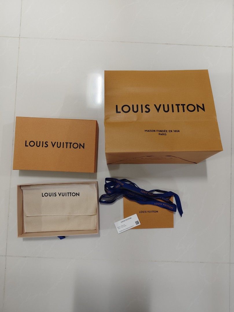 Louis Vuitton passport holder Box and paper bag set (Category: Accessories) located in Singapore. Submitted by rabbit8682 (Listing ID 1380321166, Image 1). Description: - Authentic Louis Vuitton box set - Includes original box, dust bag, ribbon, and card - Perfect for gifting or storage - Good condition From Paris.