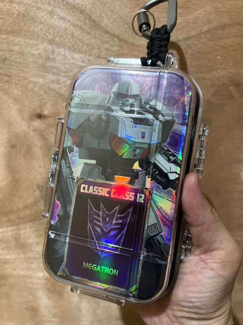 MEGATRON The ONE bag accessory (Category: Action & Battle Toys) located in Manila. Submitted by .stocklist. (Listing ID 1380476753, Image 2). Description: MEGATRON - Transformers Transformer action figure scale 1/144 (144mm) in clear case weather sealed container with paracord and crabiners. Custom backing design cut from its box. (Delivery charges not included).