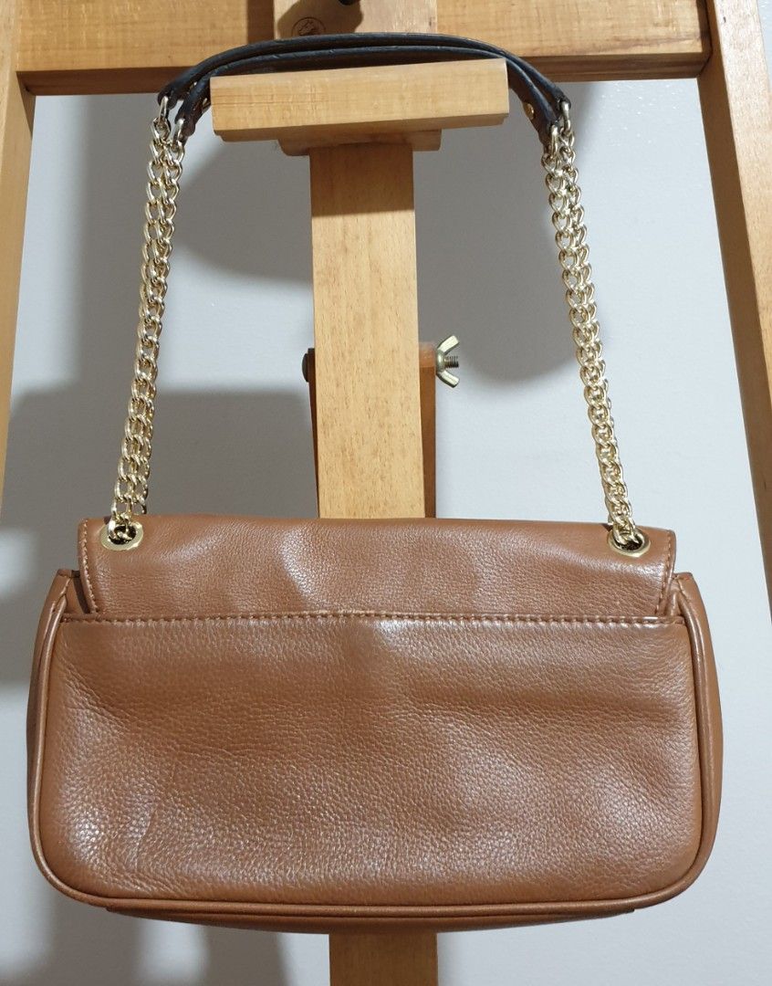 Michael Kors (Category: Luxury Bags & Wallets) located in Quezon City. Submitted by tindahan_nia (Listing ID 1380463535, Image 3). Description: Michael Kors fulton hand bag/ shoulder bag flap closure. For jeans or casual look. Logo with scratches. Can be a shoulder bag or a cross body bag. Free Kate Spade bag, (heavy flaws are only obvious in the inside of the bag).