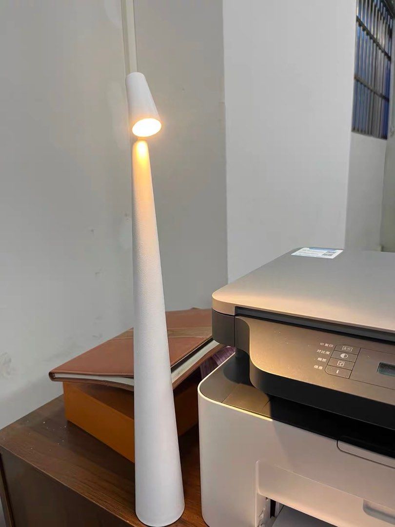 Portable White Scandinavian Table Lamp / Study light (Category: Lighting) located in Singapore. Submitted by sapporowhiskey (Listing ID 1380464274, Image 3). Description: Brand new, unused 35 cm tall Charged by type C Beautiful and portable! I have multiple colours for sale, 3 of each available Purchase multiple items from me to receive a discount!.