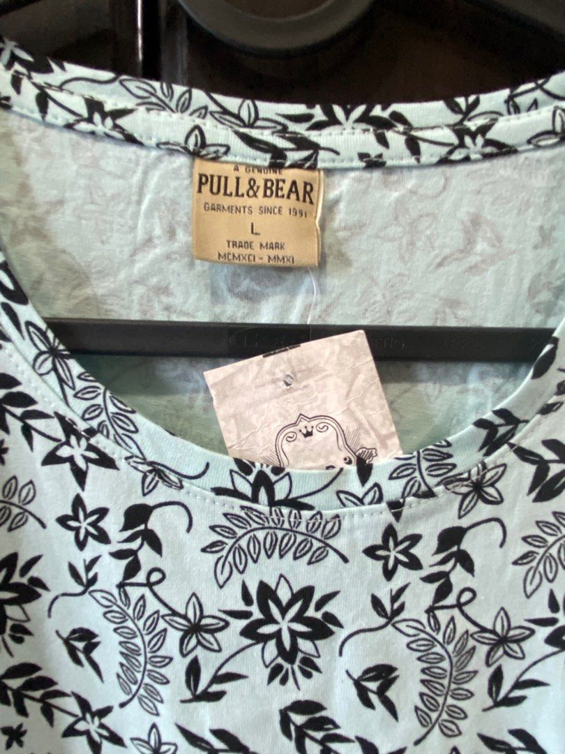 Pull & Bear Light Blue T-shirt with Black Floral Print (Category: Blouses) located in Quezon City. Submitted by corncarts (Listing ID 1380424575, Image 3). Description: Brand: Pull & Bear L on tag (34” x 26”) Light blue with black floral print T shirt with scoop neck Cotton material, very presko Slight stretch brand new with tags.