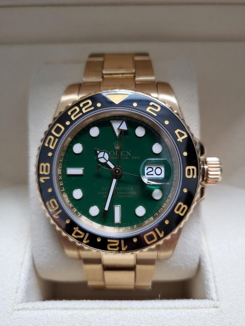 Rolex M116718LN Oyster Gmt-Master 2 Yellow Gold Green (Category: Watches) located in Singapore. Submitted by gleong07 (Listing ID 1380323282, Image 2). Description: • Rolex M116718LN Oyster Gmt • Master 2 Yellow Gold Green • Full link with RX8 protection film • Complete overhaul 09-2021 • Collectible item • Complete full set dated 2010 • Warranty card written green.