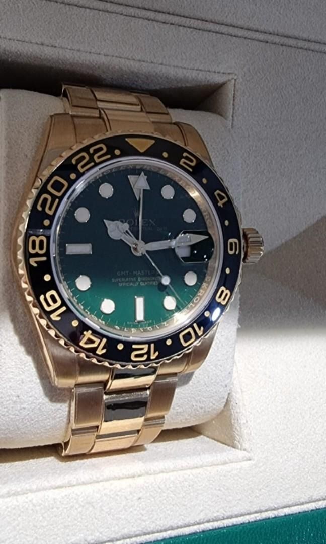 Rolex M116718LN Oyster Gmt-Master 2 Yellow Gold Green (Category: Watches) located in Singapore. Submitted by gleong07 (Listing ID 1380323282, Image 3). Description: • Rolex M116718LN Oyster Gmt • Master 2 Yellow Gold Green • Full link with RX8 protection film • Complete overhaul 09-2021 • Collectible item • Complete full set dated 2010 • Warranty card written green.