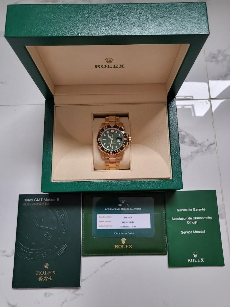 Rolex M116718LN Oyster Gmt-Master 2 Yellow Gold Green (Category: Watches) located in Singapore. Submitted by gleong07 (Listing ID 1380323282, Image 1). Description: • Rolex M116718LN Oyster Gmt • Master 2 Yellow Gold Green • Full link with RX8 protection film • Complete overhaul 09-2021 • Collectible item • Complete full set dated 2010 • Warranty card written green.