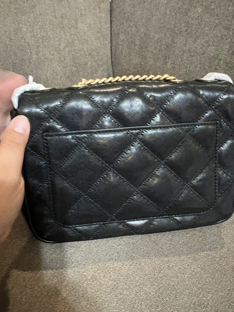 Tory Burch (TB) Willa Small Shoulder Bag - Black (Category: Luxury Bags & Wallets) located in San Pedro. Submitted by misslumi (Listing ID 1380476640, Image 3). Description: Brand New from 🇺🇸!!! Tory Burch Willa Small Shoulder Bag - Black Sealed! With polyplastic, stuffings, tags. - Quilted flap chain shoulder bag with logo emblem - Calf leather - Main flap with magnetic closure - Interior zip pocket - Interior slip pocket - Back slip pocket - 