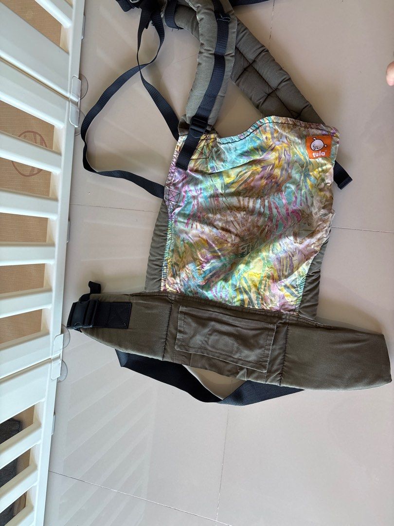 Tula Baby Carrier (Category: Carriers & Slings) located in Singapore. Submitted by joline_h_767 (Listing ID 1380350861, Image 2). Description: Used Tula baby carrier in good condition. Features adjustable straps and a comfortable design for both parent and baby. The carrier has a unique patterned front panel. Perfect for carrying your little one safely and comfortably. my helper clean it nicely, routinely after we use .