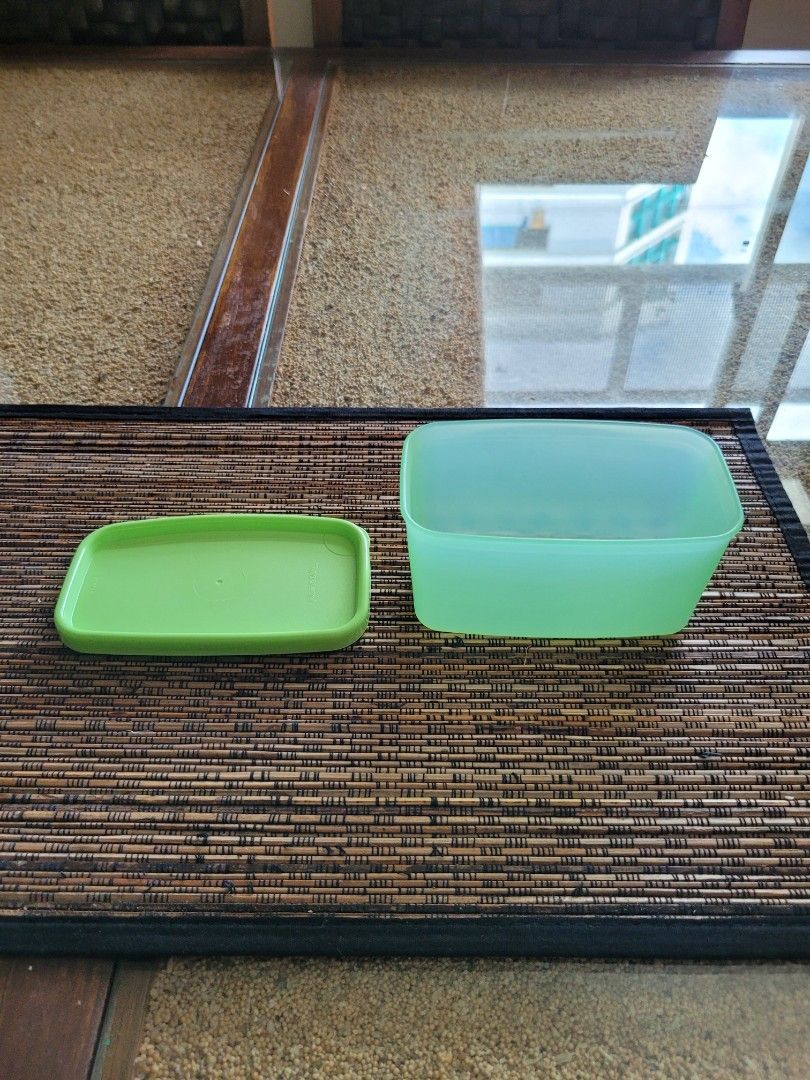 Tupperware (Category: Food Organisation & Storage) located in Singapore. Submitted by teresa1368 (Listing ID 1380324338, Image 3). Description: Tupperware storage container. Brand New. Color: Orange/Yellow/Bluez/Green. Size: 4.5 inch x 2.5 inch x 2.5 inch Price: $20 per set ( 4 pcs).