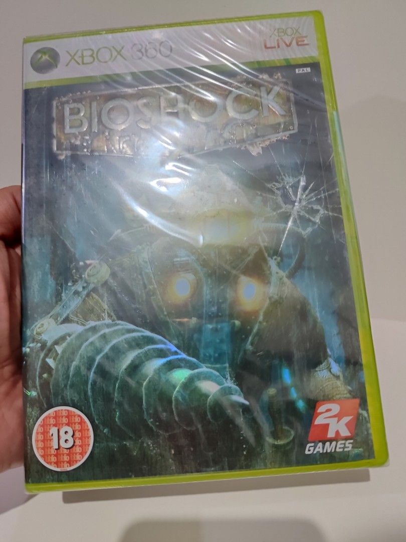 XBOX 360 - Bioshock 2 (BRAND NEW) "PAL" (Category: Xbox) located in Mendez-Nunez. Submitted by sf2_gameshop (Listing ID 1380449471, Image 2). Description: PLEASE READ: This game will work on a PAL Xbox 360 units. Untested on NTSC-J & PAL regions. PAL - √ (Yes) NTSC/J - ? (Untested) NTSC - ? (Untested) CONDITION: A brand new item and sealed (Y-fold). GENRE: First-person shooter MODE: Single-player REGION: PAL (Europe) VOICE: English TEXT: English 