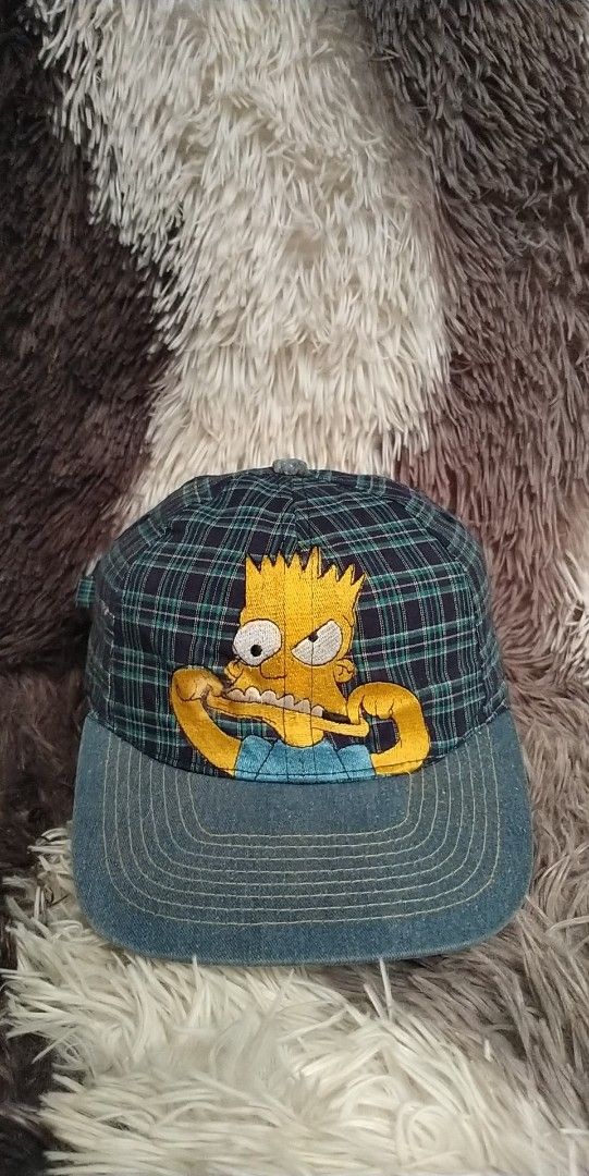 1998 THE SIMPSONS CAP YOUTH SIZE (Category: Caps & Hats) located in Pili. Submitted by janrypalmerodelima (Listing ID 1380658902, Image 1). Description: 1998 THE SIMPSONS CAP YOUTH SIZE CONDITION: VERY GOOD COLOR RATE: 9.3/10 ISSUE:SEE LAST PHOTO.