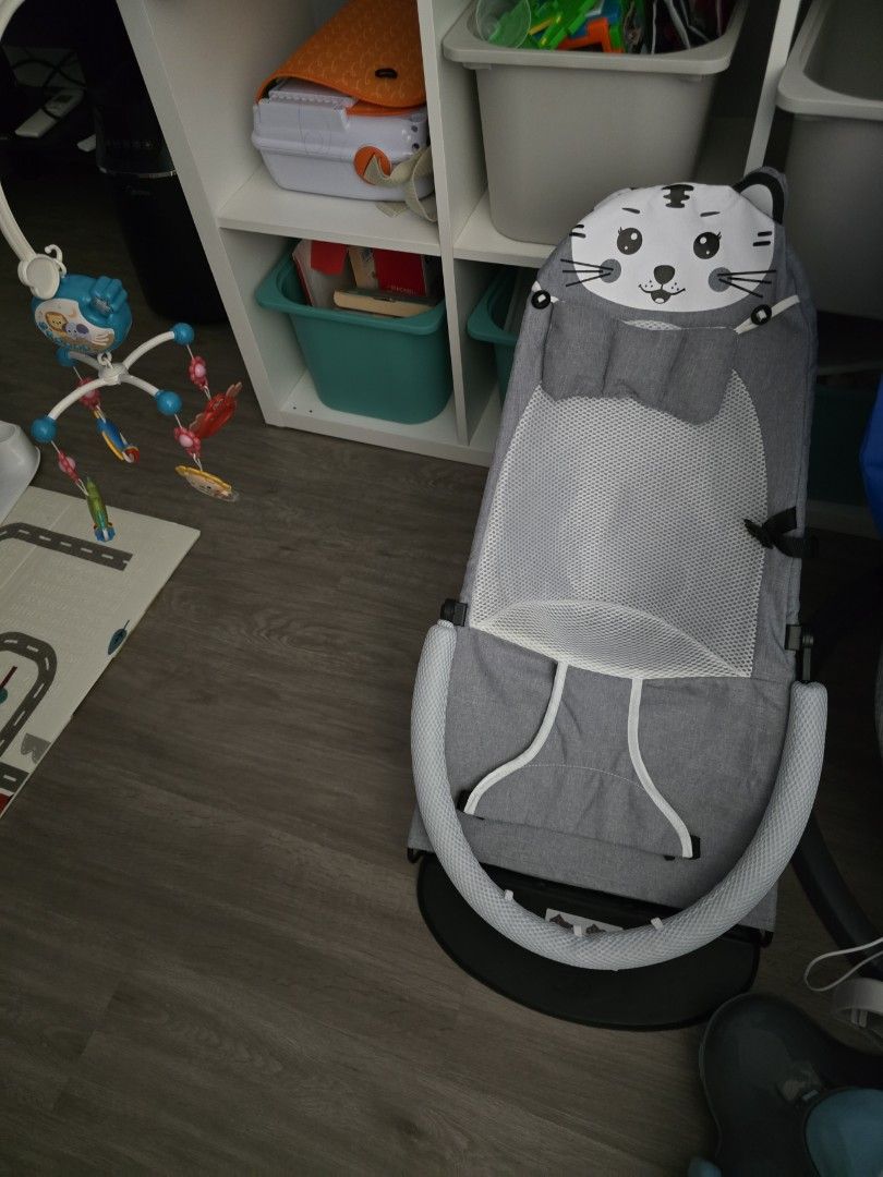 Baby Bouncer with Cat Design (Category: Infant Playtime) located in Singapore. Submitted by z.shaw (Listing ID 1380643605, Image 1). Description: - Adorable baby bouncer with a charming cat design. - Features a comfortable and supportive seat. - Equipped with a secure harness for safety. - Keeps your baby entertained and relaxed. - In great condition and ready for use..