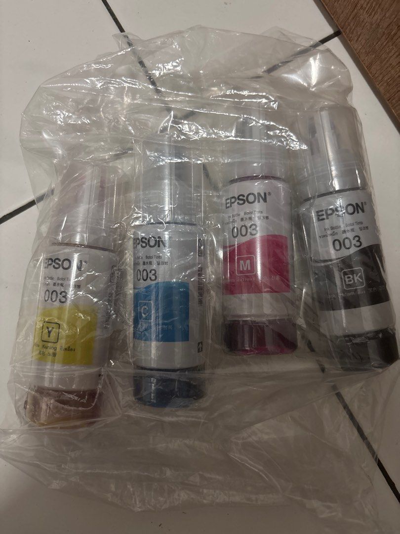 Epson 003 Ink Bottle Set -Initial ORIGINAL (Category: Printers, Scanners & Copiers) located in Singapore. Submitted by nanapaperstudio (Listing ID 1380540625, Image 1). Description: Selling a brand new Epson 003 ink bottle set. This set includes the yellow ink bottle. It's perfect for your Epson printer and ensures vibrant, high-quality prints. The ink is sealed and ready to use. If you're looking for a reliable ink solution, this is a great choi