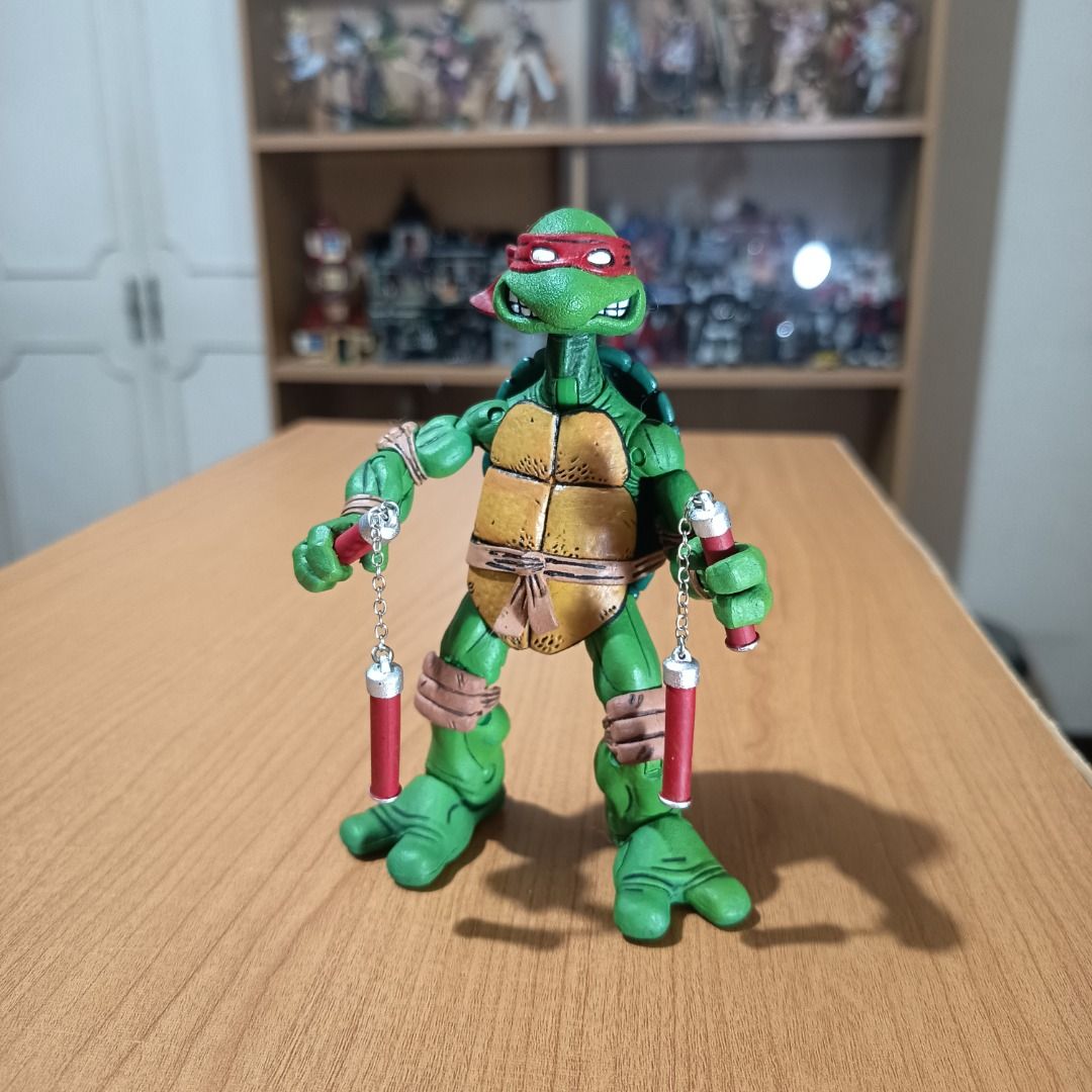 NECA Michelangelo (TMNT Mirage Comics) (Category: Figurines & Statues) located in Paranaque City. Submitted by coolcollectorstuff (Listing ID 1380570246, Image 2). Description: Mirage Comics TMNT Michelangelo - Manufacturer: NECA - Loose but in good condition, slightly sticky - Comes with box and accessories (2 nunchucks, 3 projectiles, 2 hands, 1 small turtle, 1 base) - Originally released in 2008 (RARE).