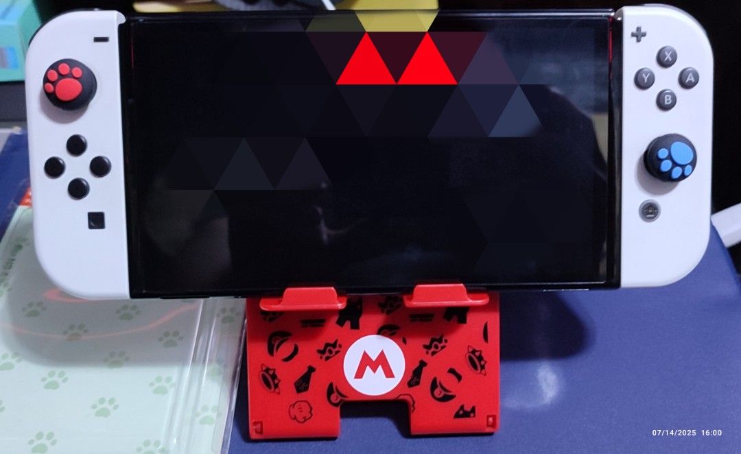 Nintendo Switch V1, V2, Lite & OLED Foldable Stand [Super Mario M- Logo] (Category: Nintendo) located in Rizal. Submitted by giorgio_tsoukalos (Listing ID 1380578210, Image 2). Description: Nintendo Switch V1, V2, Lite & OLED Foldable Stand [Super Mario M- Logo] Once Used / Almost New Please see actual photos for reference Dimes: 4"W X 5"H Mode of Payment: GCash/Cash Add SF via LBC /JNT Add Delivery Fee via Lalamove.