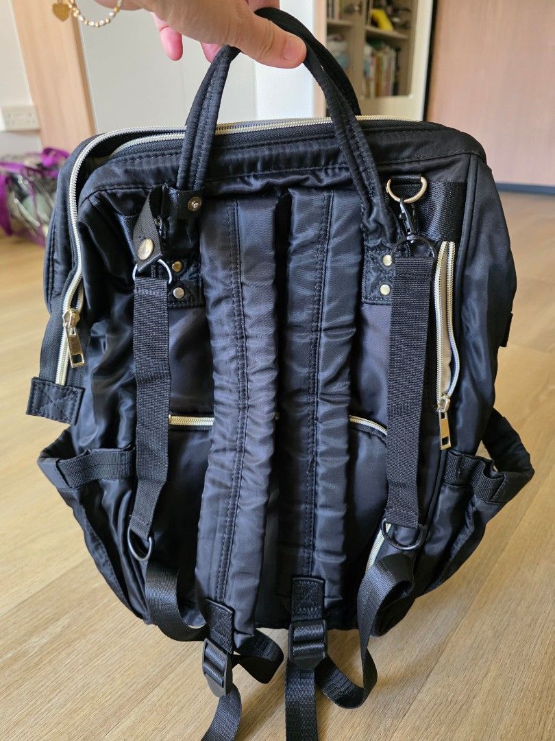 Petalbaby Diaper Bag - Black (Category: Diaper Bags & Wetbags) located in Singapore. Submitted by snowyigoh (Listing ID 1380501830, Image 2). Description: - Stylish diaper bag in black - Features multiple compartments and pockets - Includes a zippered pocket - Neutral-colored interior - Ideal for parents on the go.