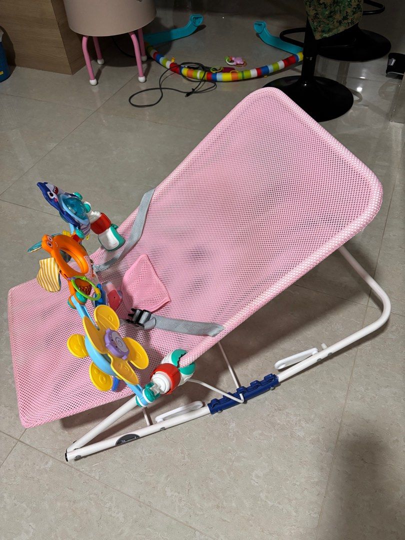 Bouncer - Pink with Toy Bar (Category: Infant Playtime) located in Singapore. Submitted by whiskeybabu (Listing ID 1380836973, Image 3). Description: Gently used bouncer in pink. Includes toy bar. The mesh fabric is breathable and easy to clean. Perfect for keeping your baby entertained and comfortable. From a smoke-free home..