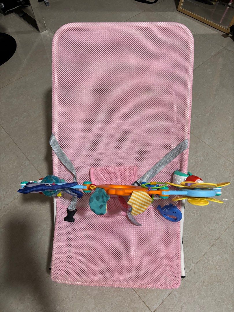 Bouncer - Pink with Toy Bar (Category: Infant Playtime) located in Singapore. Submitted by whiskeybabu (Listing ID 1380836973, Image 2). Description: Gently used bouncer in pink. Includes toy bar. The mesh fabric is breathable and easy to clean. Perfect for keeping your baby entertained and comfortable. From a smoke-free home..