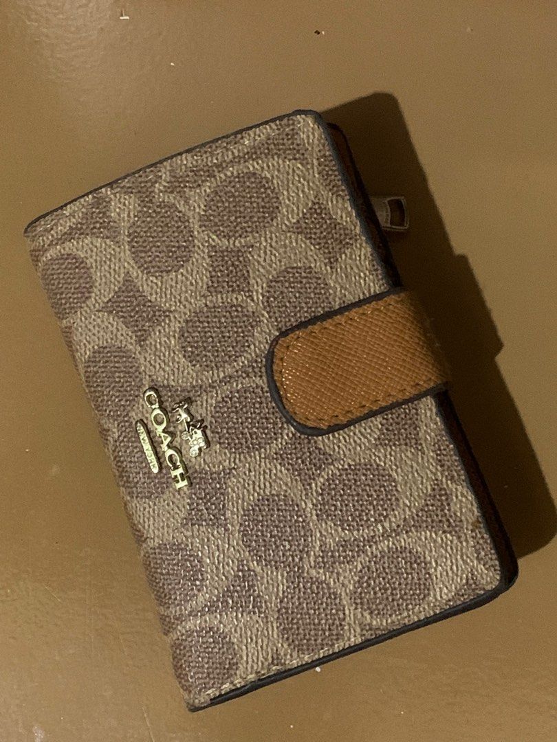 Branded Brown Wallet (Category: Wallets & Card holders) located in Batangas. Submitted by wcwonwon (Listing ID 1380826431, Image 1). Description: Coach wallet Barely used with minimal flaw Bought for 1200 No box. Wallet only. Will send w a bubble wrap. Can send video condi if needed.
