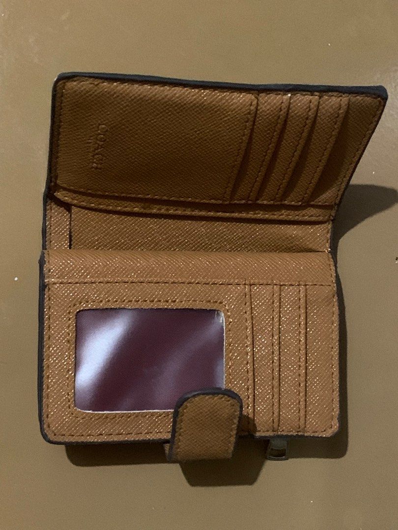 Branded Brown Wallet (Category: Wallets & Card holders) located in Batangas. Submitted by wcwonwon (Listing ID 1380826431, Image 2). Description: Coach wallet Barely used with minimal flaw Bought for 1200 No box. Wallet only. Will send w a bubble wrap. Can send video condi if needed.