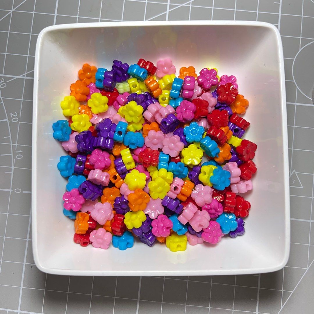 Flower Beads - Assorted Colors (Category: Craft Supplies & Tools) located in Singapore. Submitted by cinabonbon (Listing ID 1380782983, Image 1). Description: Colorful flower-shaped beads perfect for crafting. These beads come in a variety of vibrant colors, ideal for jewelry making, DIY projects, or adding a playful touch to your creations. Great for kids and adults alike!.
