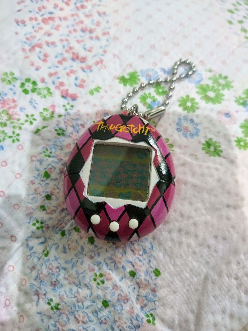 GEN 1 TAMAGOTCHI - MAJESTIC (Category: Interactive Toys) located in Quezon. Submitted by goldenwolf21 (Listing ID 1380717504, Image 1). Description: TAMAGOTCHI GEN1 MAJESTIC for sale color PURPLE 1 x tamagotchi MOP Gcash/BPI/Landbank buyer shoulder the shipping fee JRS/LBC/JNT/JORO pm for inquiries.