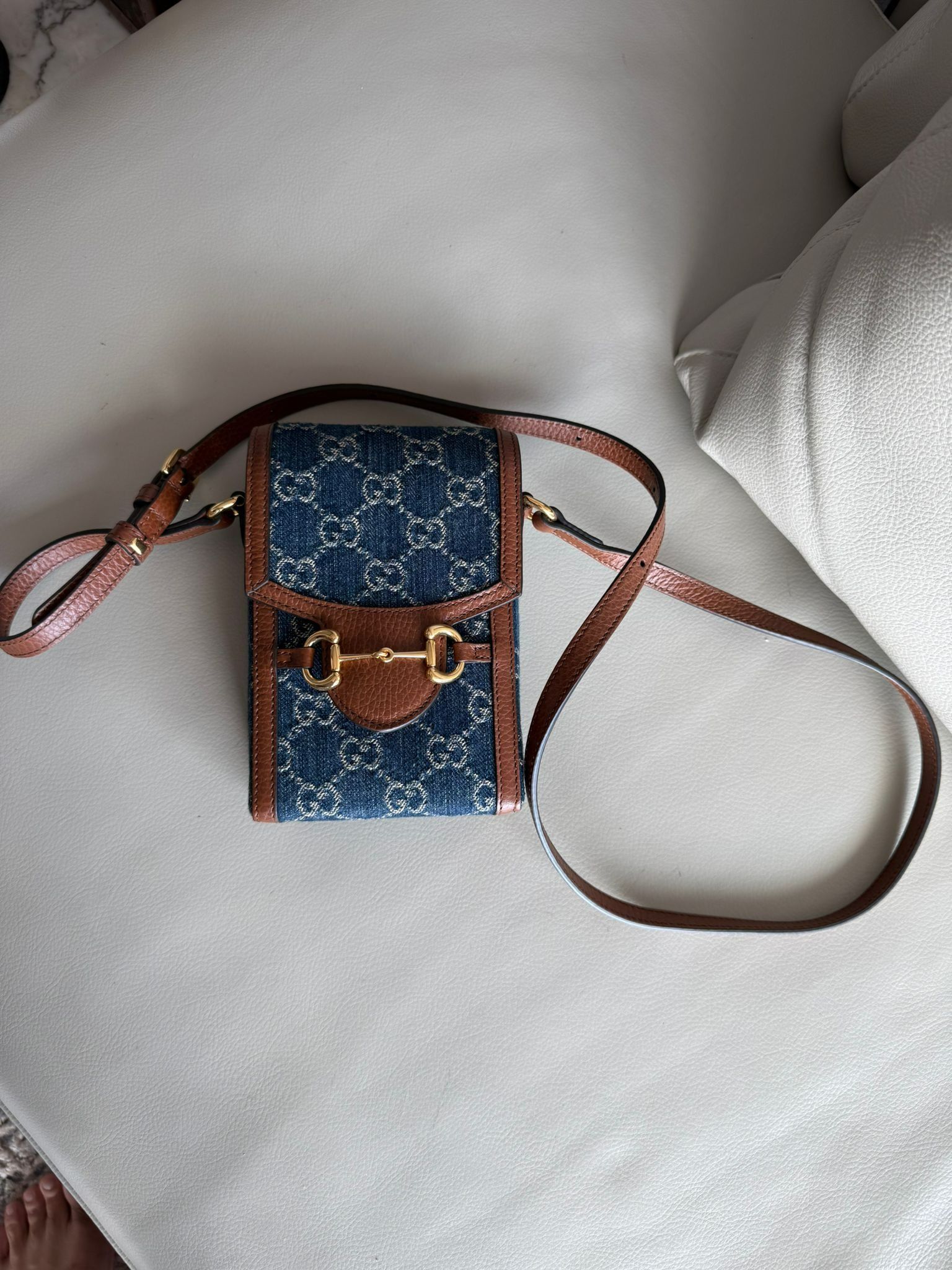 Gucci Small Sling Bag (Category: Bags & Wallets) located in Singapore. Submitted by nicholasim00631 (Listing ID 1380795191, Image 1). Description: Used only twice. Gucci Small sling bag, dark blue fabric and leather. .