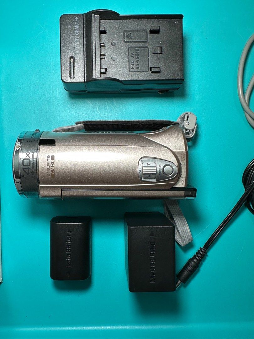 JVC EVERIO GZ-E117N Rose Gold (Category: Video Cameras) located in Marikina City. Submitted by aacvv (Listing ID 1380837612, Image 3). Description: Recording Definition: Standard Definition and High Definition. Optical Zoom: 40x. Media Format: MicroSDHC, SD. Features: Built-in microphone, LCD screen, face detection. Color: Rose Gold Connectivity: USB. Other Features: May include image stabilization and a touch screen. Storage: Uses SD/SDHC cards.
