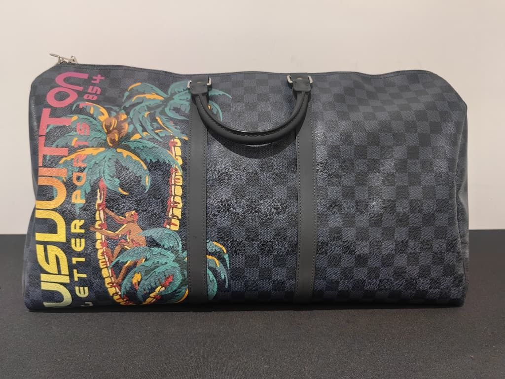 LOUIS VUITTON KEEPALL BANDOULIERE JUNGLE 55 DAMIER COBALT GHW (NO STRAP) (Category: Bags & Wallets) located in Kuala Lumpur. Submitted by larueonlinestore (Listing ID 1380784703, Image 1). Description: LAR-3949-LV (Pre-owned) Brand - LOUIS VUITTON KEEPALL BANDOULIERE JUNGLE 55 DAMIER COBALT GHW Model - KEEPALL BANDOULIERE 55 Size - 55CM Color - COBALT Material -COATED CANVAS Accessories - NO Condition - USED Visit our store to view the actual pro