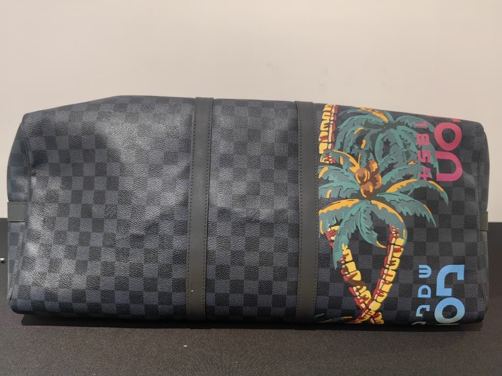 LOUIS VUITTON KEEPALL BANDOULIERE JUNGLE 55 DAMIER COBALT GHW (NO STRAP) (Category: Bags & Wallets) located in Kuala Lumpur. Submitted by larueonlinestore (Listing ID 1380784703, Image 3). Description: LAR-3949-LV (Pre-owned) Brand - LOUIS VUITTON KEEPALL BANDOULIERE JUNGLE 55 DAMIER COBALT GHW Model - KEEPALL BANDOULIERE 55 Size - 55CM Color - COBALT Material -COATED CANVAS Accessories - NO Condition - USED Visit our store to view the actual pro