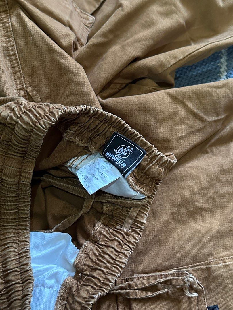 NP Cocoon Rebirth Wide Leg Cargo Pants (Category: Trousers) located in Quezon City. Submitted by adeecee1212 (Listing ID 1380868868, Image 3). Description: NP Cocoon Rebirth Wide Leg Cargo Pants Brown (random Chinese brand) Adjustable 26-36 Length: 36 in Inseam: 23 in Leg Opening: 10 in (adjustable) XL on tag 800 PHP.