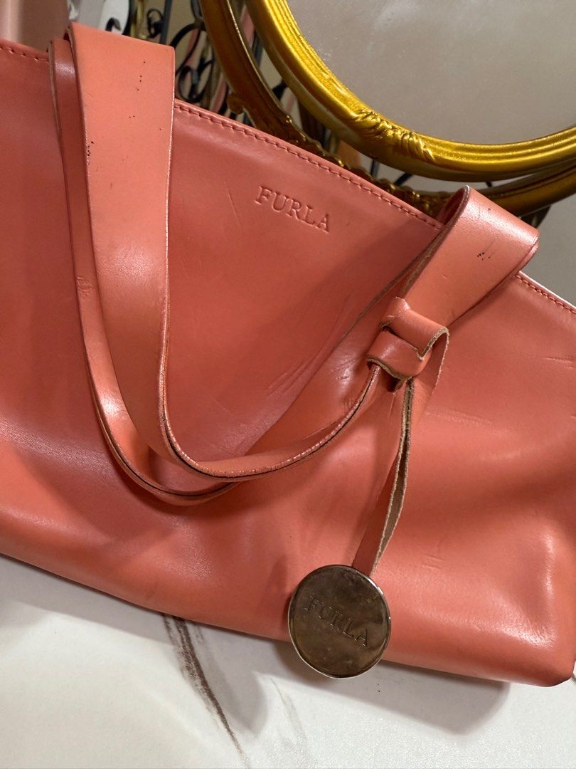 Furla Pink leather handbag (Auth) (Category: Luxury Bags & Wallets) located in Limay. Submitted by fashionshop248 (Listing ID 1380836556, Image 2). Description: Preloved Furla Bags! Authentic -flaws may mga dents dents -never nagamit -nadaganan ng mga gamit kaya nagka dents -malinis loob.