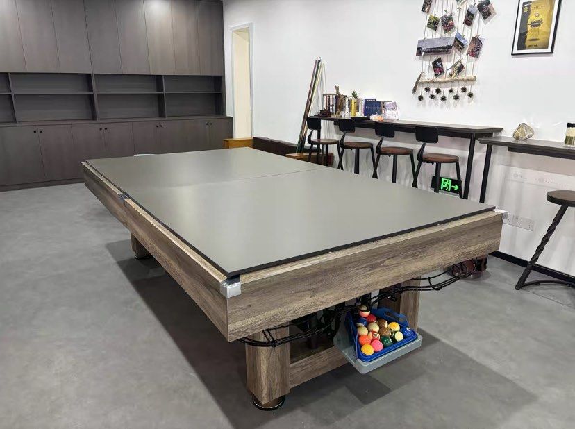 Pool table (Category: Billiards & Bowling) located in Singapore. Submitted by estorapooltable (Listing ID 1380772097, Image 2). Description: This versatile table is a 3-in-1 design, functioning as a billiard table, ping pong table, and dining table. It comes with all the accessories shown in the images, including billiard balls, cues, and ping pong equipment. Table cloth color options are available. Perfect for home or office use..
