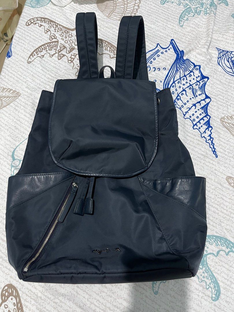 Agnes B nylon backpack (Category: Luxury Bags & Wallets) located in Cabuyao City. Submitted by yhaniesgph (Listing ID 1381075971, Image 1). Description: Like new condition. Issue is parang may run (see last pic), no other issues..