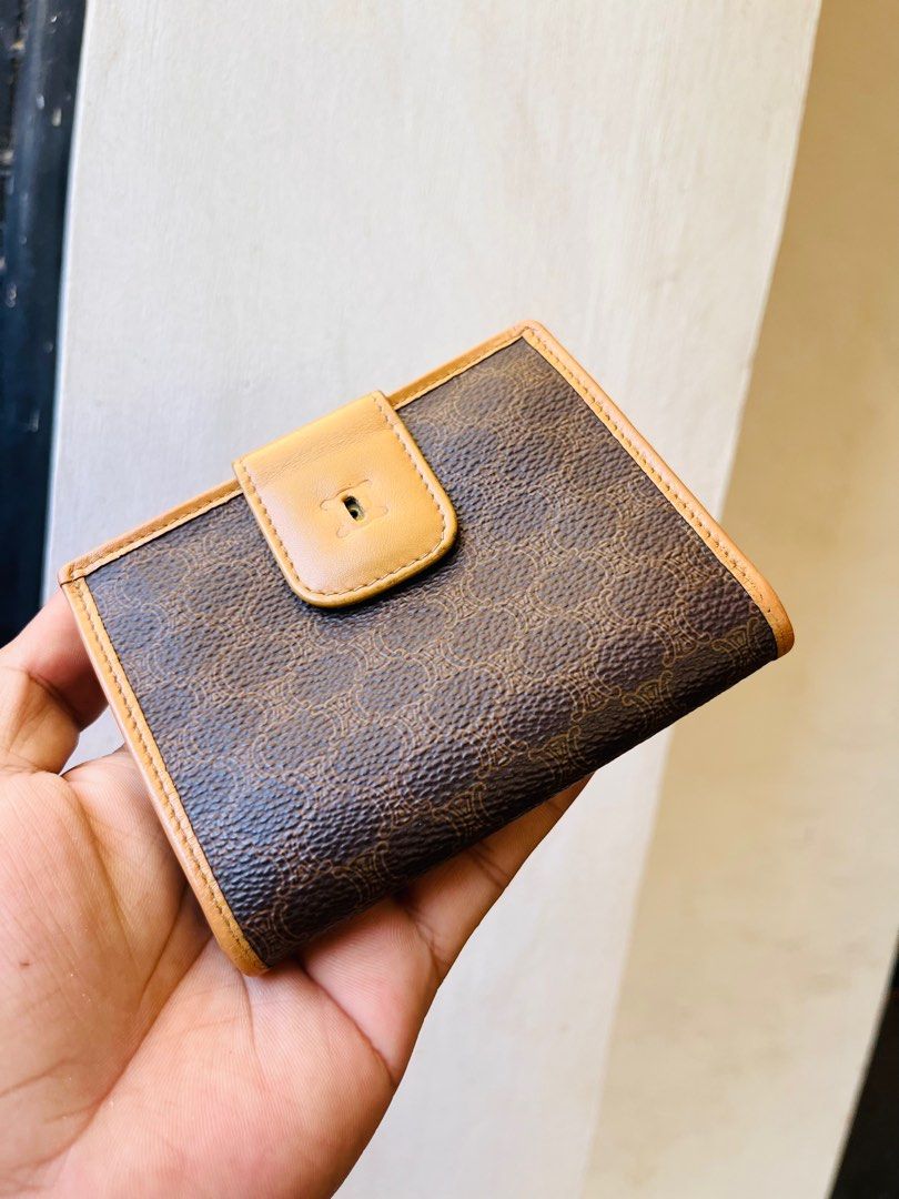 Authentic celine wallet (Category: Luxury Bags & Wallets) located in Ballesteros. Submitted by sat_b3 (Listing ID 1380919741, Image 1). Description: Authentic celin e bifold wallet Pls check all pics Retouched rin po yung gilid kc nagdark na yan dati.. Mejo may tallent tayo sa mga ganyan kaya ok na.. Issue: natanggal yung logo sa ibabaw ng lock.. 🫰🏻may leather akong logo ng celi ne baka kusto nyong ilagay ko.. 😊 ✅1,680 add sf.