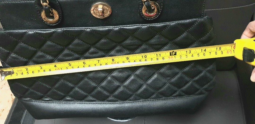 Black quilted Morgan 2-way bag (Category: Shoulder Bags) located in Quezon City. Submitted by practibagsplusmnl (Listing ID 1381038287, Image 2). Description: Black quilted Morgan 2-way bag; longer strap made of woven chain-leather. With 1 exterior, many interior pockets. Beautiful bag..