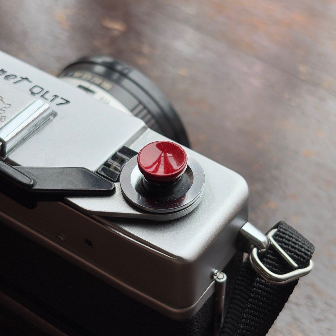 Camera Soft Shutter Button/Screw (Category: Other Photography Accessories) located in Singapore. Submitted by SurprisedPika (Listing ID 1381012965, Image 1). Description: Can be used on film cameras and Fujifilm cameras. Easy screw in and provides extra comfort when shooting with your camera. Also works as a conversation starter given how the colours pop or the unique designs like Spongebob & Pokeball! :) .