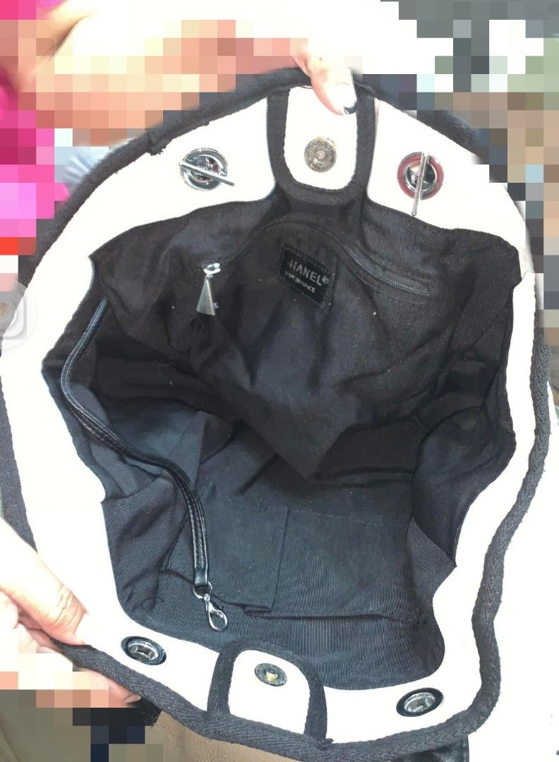 Channel Canvas Bag (Category: Luxury Bags & Wallets) located in Marikina City. Submitted by izzy_00 (Listing ID 1380941563, Image 3). Description: Canvas white and black in color large size very spacious no sling pre loved.