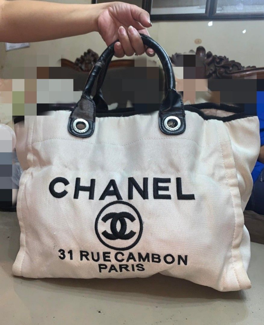 Channel Canvas Bag (Category: Luxury Bags & Wallets) located in Marikina City. Submitted by izzy_00 (Listing ID 1380941563, Image 1). Description: Canvas white and black in color large size very spacious no sling pre loved.