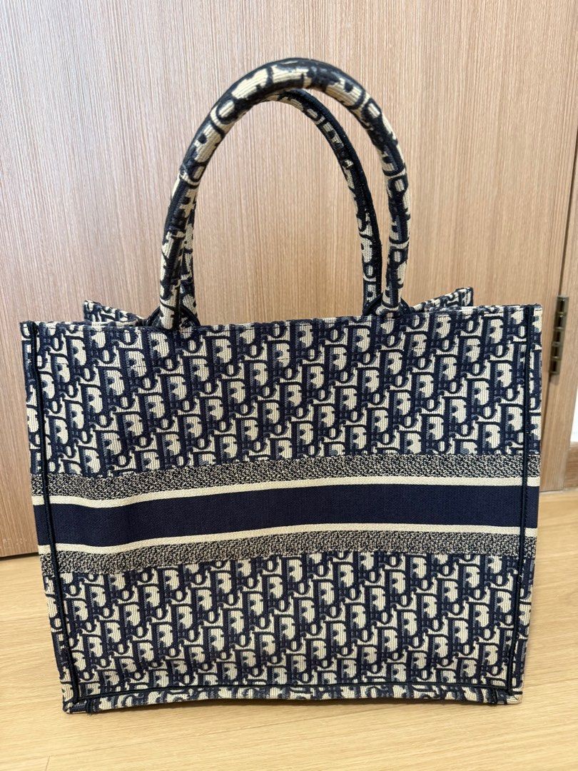 DIOR LARGE BOOK TOTE Blue Dior Oblique Embroidery (Category: Bags & Wallets) located in Singapore. Submitted by 2delulu (Listing ID 1380976796, Image 2). Description: No noticeable flaws (refer to images) Excellent condition, used a few times only Comes with authenticity card and dust bag Large (42 × 35 × 18.5) Collection at my place (East) Current RTP SGD 4,900.